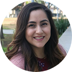 Headshot of Erika Torres, 2021 Graduate, a woman with long brown hair who is wearing a pink blouse.