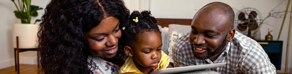 Family looking at tablet together