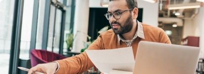 Man working on computer in office building