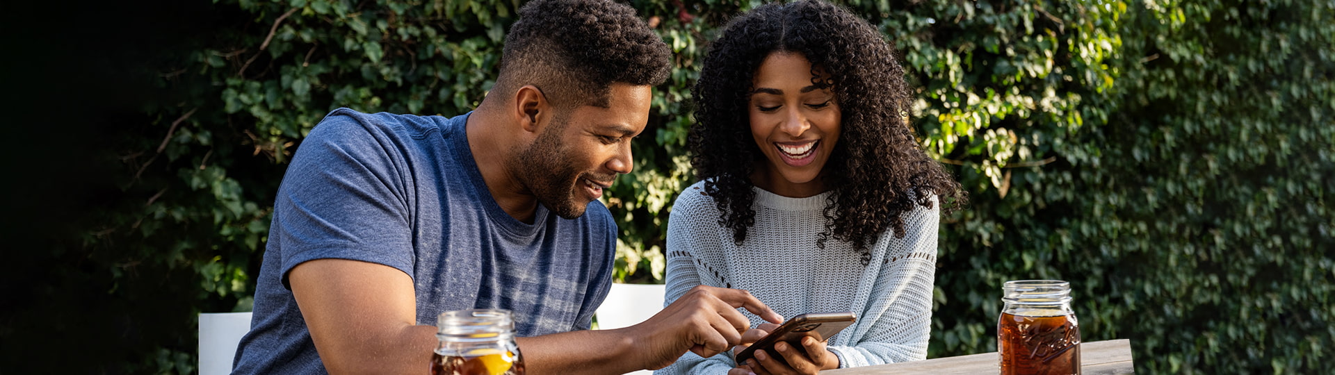 Man and woman looking at phone