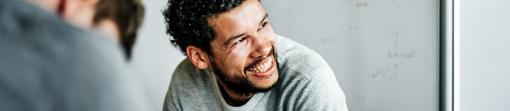 man smiling looking off into the distant