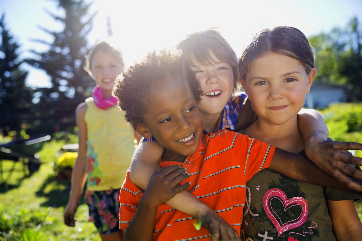Playful children in community garden